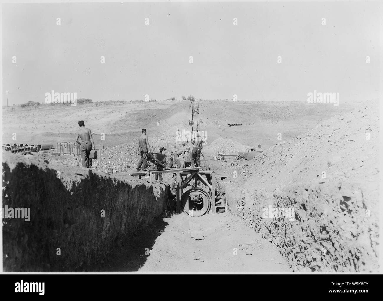 CCC Camp BR-66 Yakima-Tieton Project: Photo of construction of 48 inch monolithic reinforced concrete siphon. Looking downstream. F. A. Castle photographer. Stock Photo