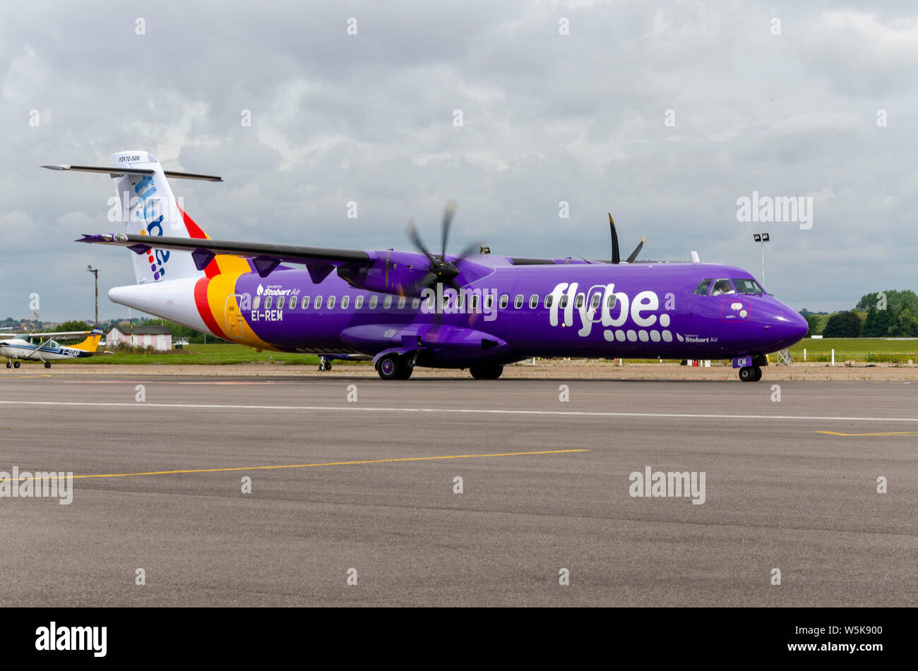 Flybe ATR 72 EI-REM airliner plane taxiing in at London Southend Airport, Essex, UK. Purple scheme. Operated by Stobart Air Stock Photo