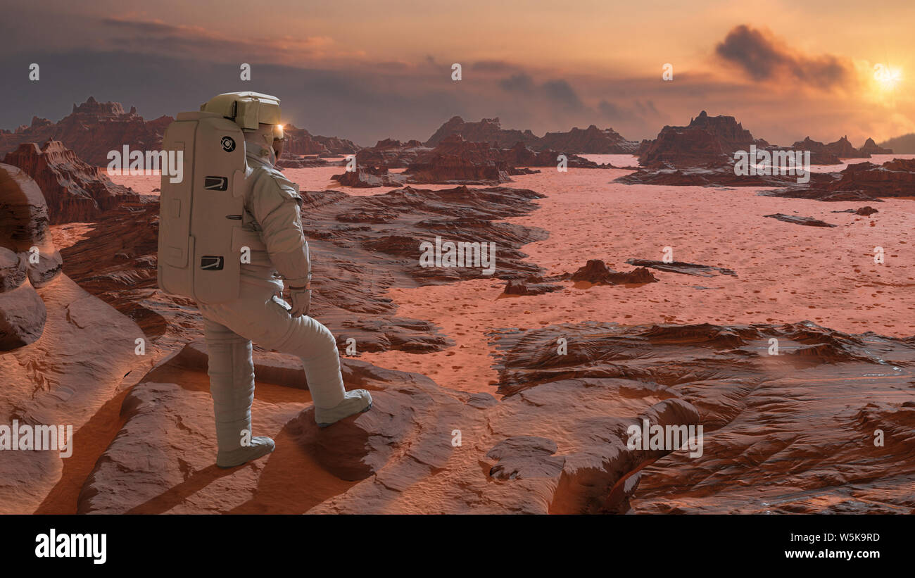 astronaut on planet Mars watching the rising Sun Stock Photo
