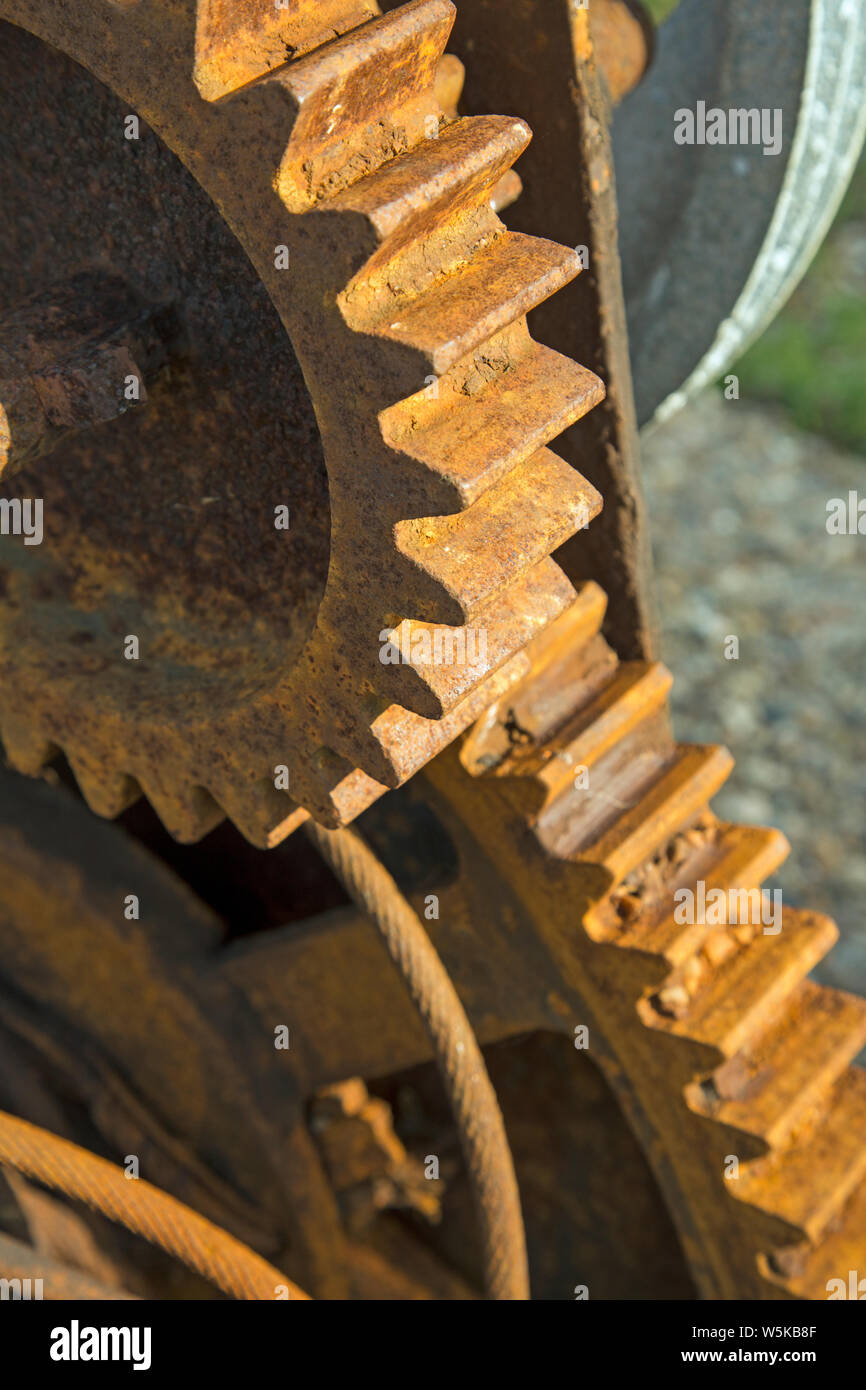 Close up on the rusted gear wheels of a machine Stock Photo