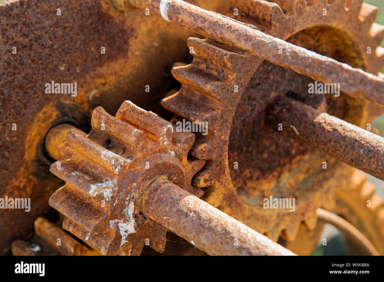Close up on the rusted gear wheels of a machine Stock Photo