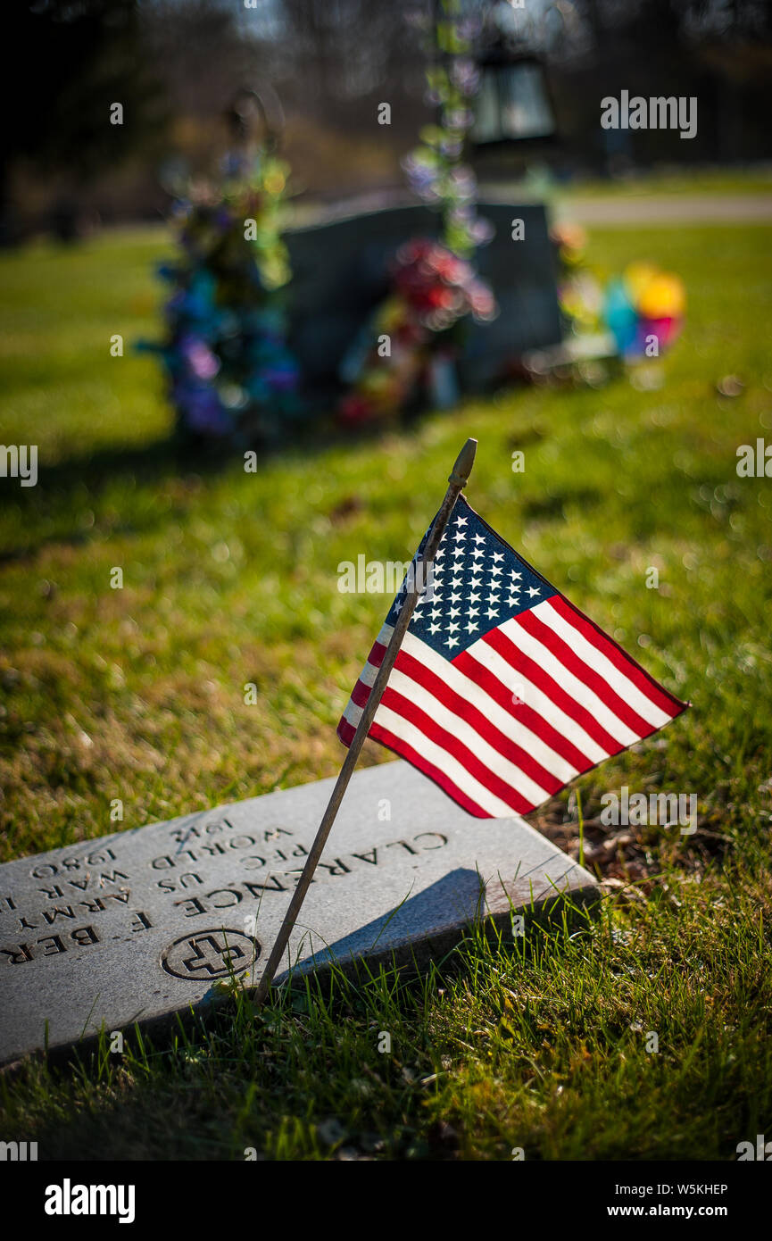 An American flag adorns the gravesite of a United States military