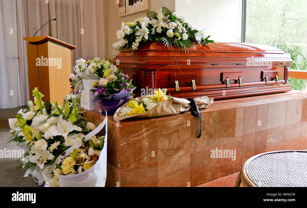closeup shot of a funeral casket in a hearse or chapel or burial at