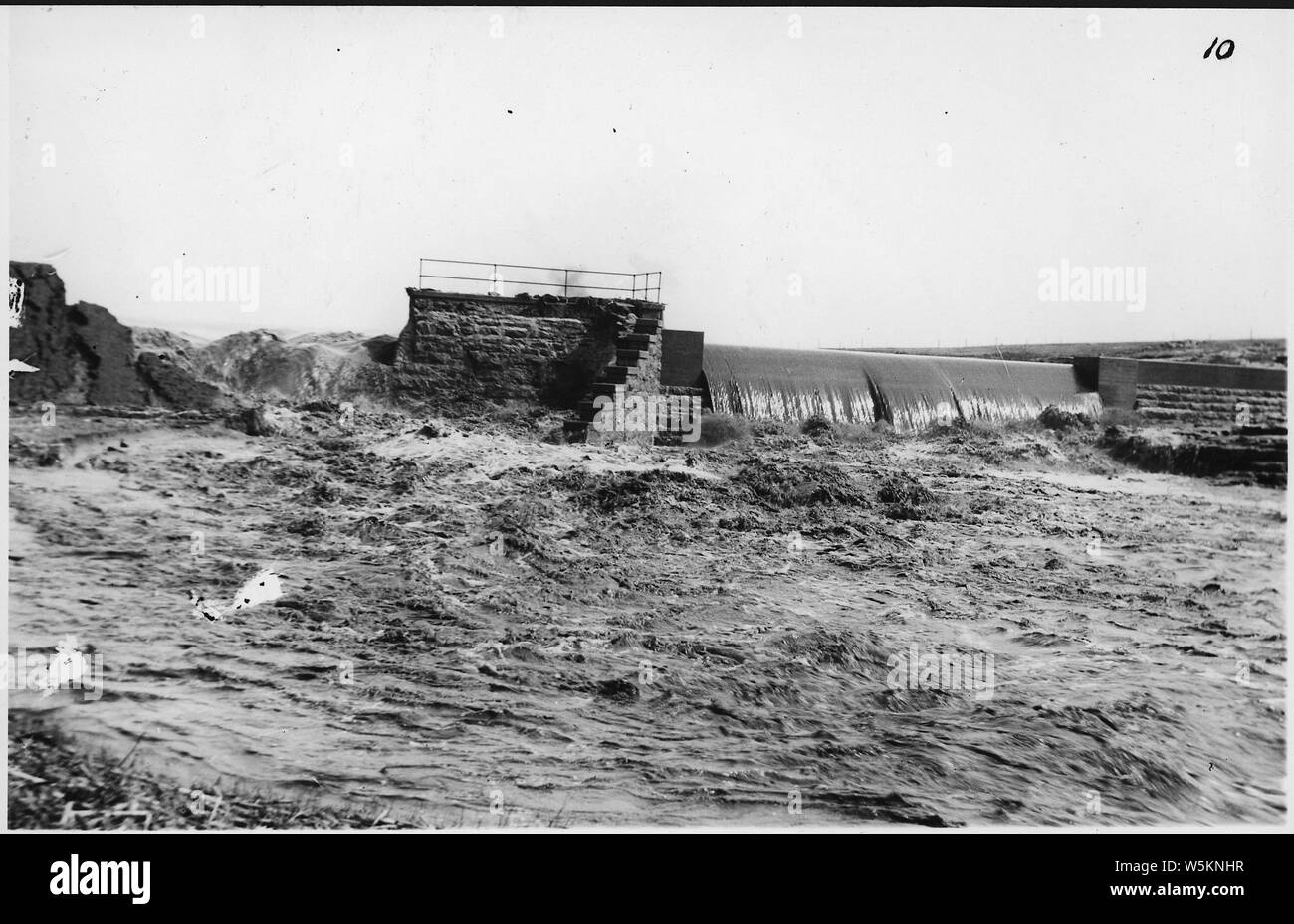 Damaged dam, with water flowing through it. Mound Lake, Minnesota Stock