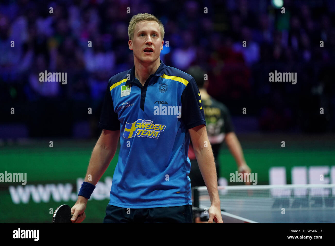 Mattias Falck of Sweden reacts as he competes against Ma Long of China in their final match of Men's Singles during the Liebherr 2019 ITTF World Table Stock Photo