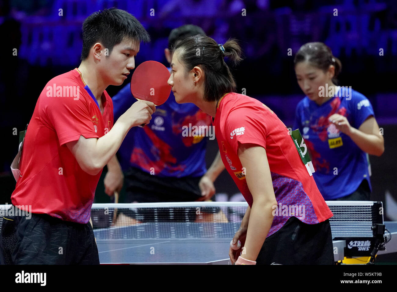 Fan Zhendong and Ding Ning of China react as they compete against Xu Xin  and Liu Shiwen of China in their semifinal match of Mixed Doubles during  the Stock Photo - Alamy