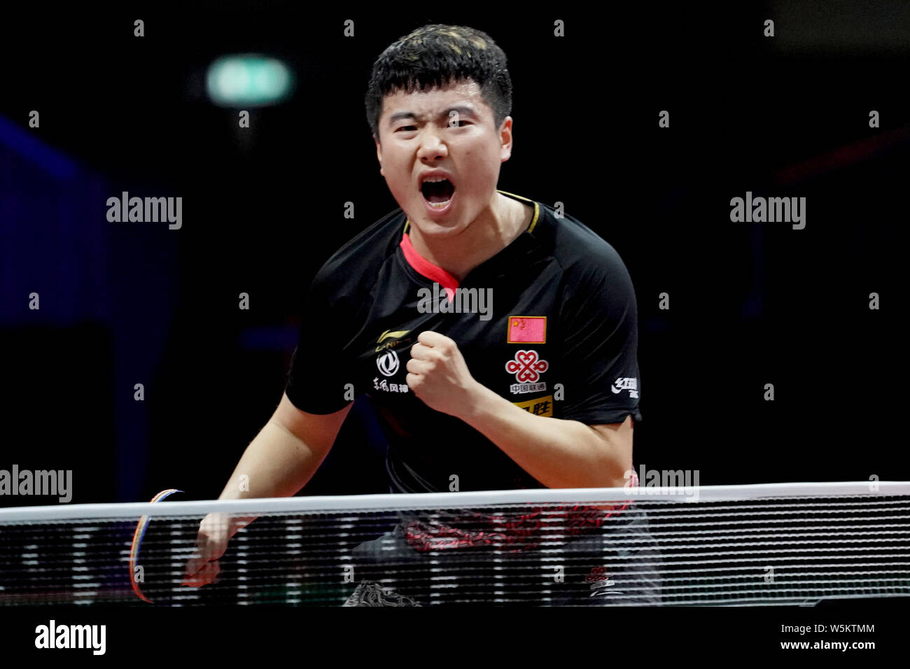Liang Jingkun of China celebrates after scoring against Panagiotis Gionis of Greece in their third round match of Men's Singles during the Liebherr 20 Stock Photo
