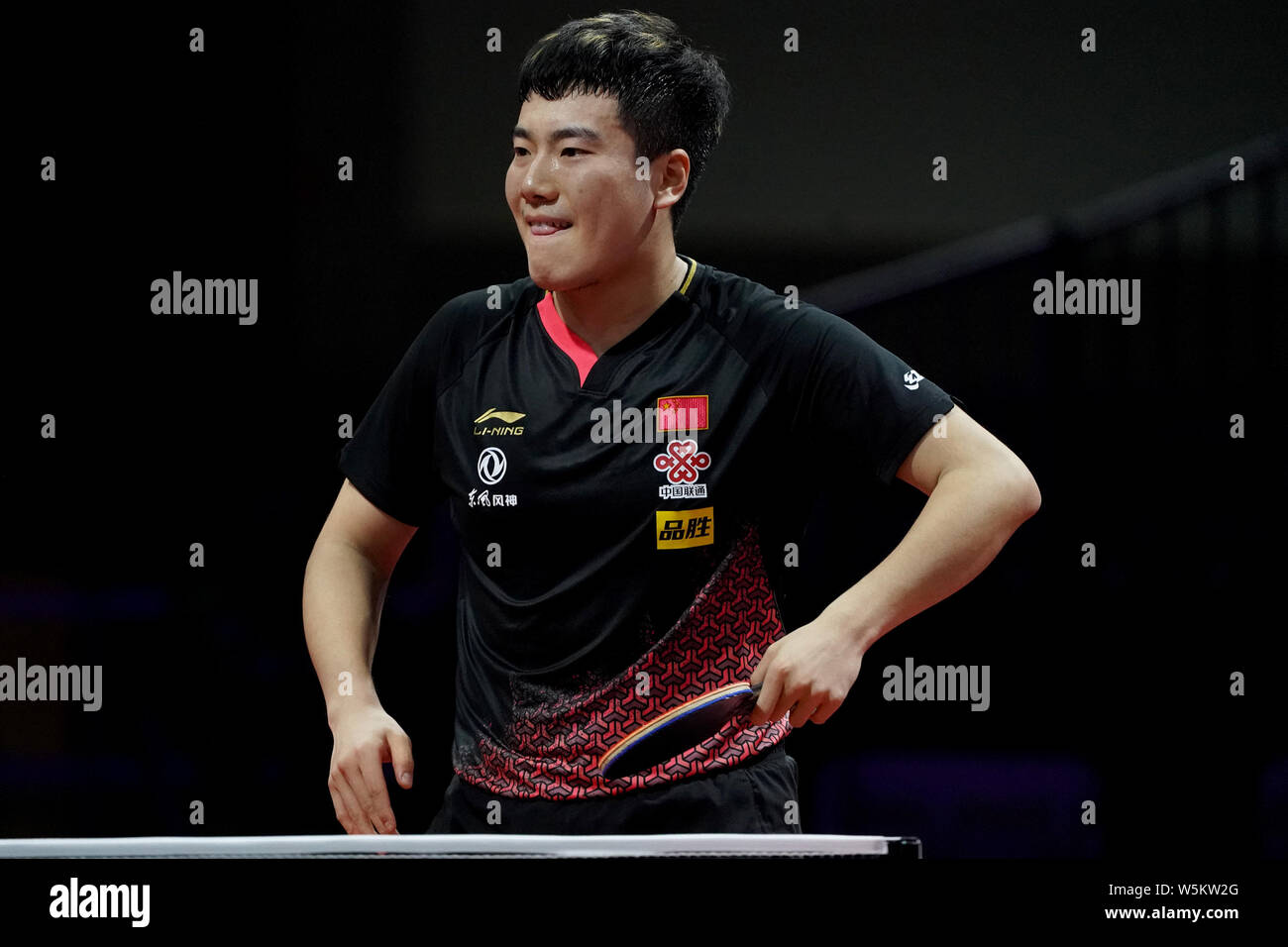 Liang Jingkun of China reacts as he competes against Panagiotis Gionis of Greece in their third round match of Men's Singles during the Liebherr 2019 Stock Photo