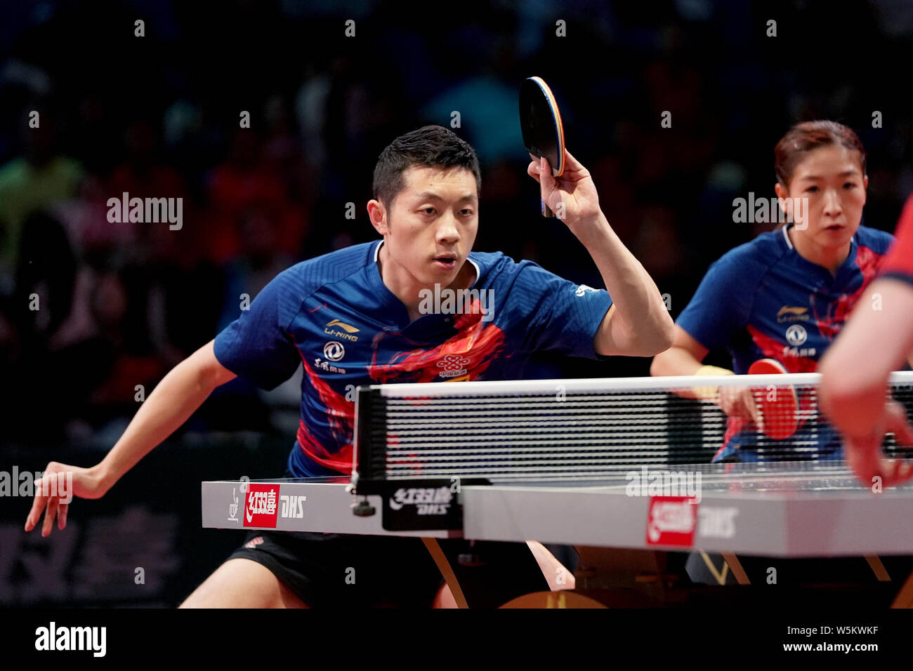 Xu Xin and Liu Shiwen of China return a shot to Luka Mladenovic and Ni Xia