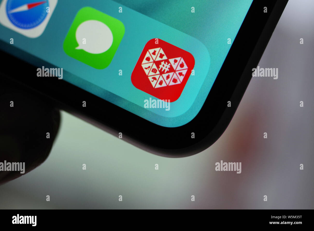 A netizen shows the icon of Chinese social e-commerce giant Pinduoduo ...