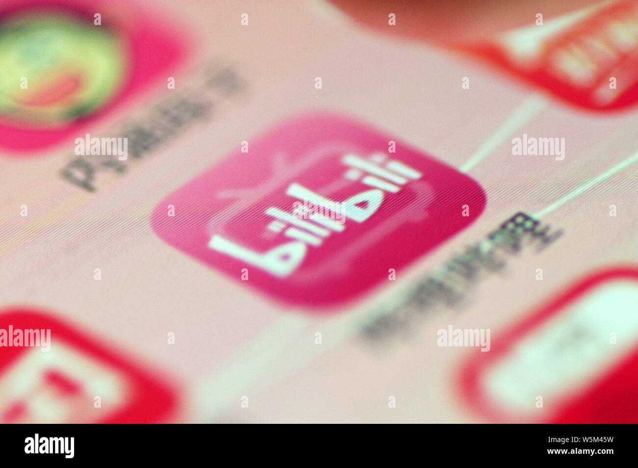 --FILE--A netizen shows an icon of the mobile app of Chinese streaming ...