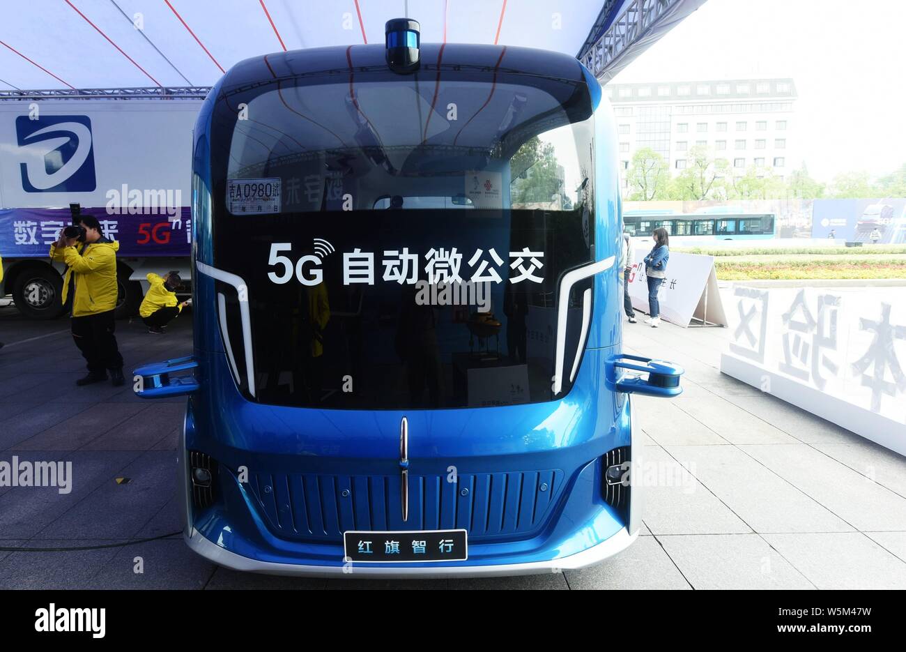 A FAW Hongqi or Red Flag unmanned 5G minibus is parked during an expo in Hangzhou city, east China's Zhejiang province, 27 April 2019.   An unmanned 5 Stock Photo