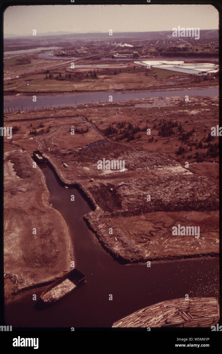 EBEY ISLAND IN THE SNOHOMISH RIVER ESTUARY. INDUSTRIAL WASTE FROM SEATTLE IS BEING DEPOSITED HERE TO MAKE A LANDFILL ON THE TULALIP INDIAN RESERVATION. BECAUSE OF POTENTIAL DAMAGE FROM CHEMICALS LEACHING INTO THE WATER TABLE, EPA HAS RECOMMENDED THAT THE SITE BE CLOSED Stock Photo