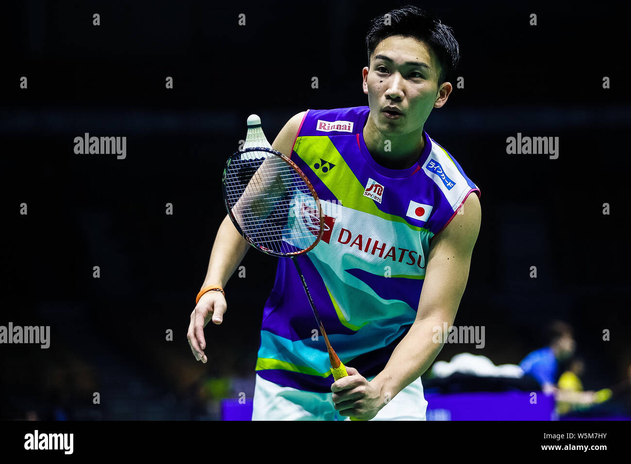 Kento Momota of Japan returns a shot to Lee Dong-keun of South Korea in ...