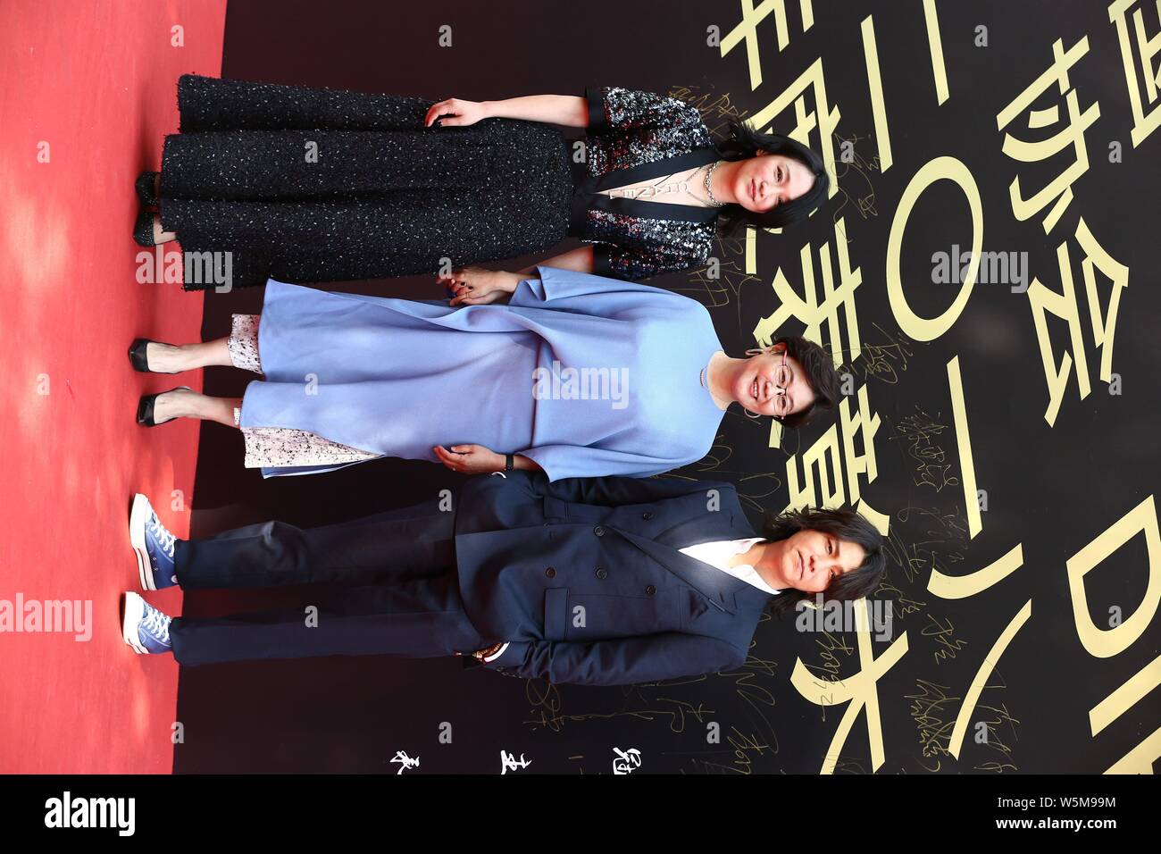 (From left) Chinese actress Zhou Xun, director Li Shaohong, and actor Chen Kun attend the 10th China Film Directors' Guild Awards ceremony in Beijing, Stock Photo