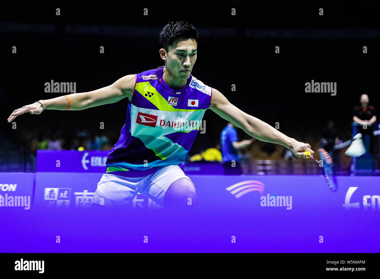 Kento Momota of Japan returns a shot to Lee Dong-keun of South Korea in ...