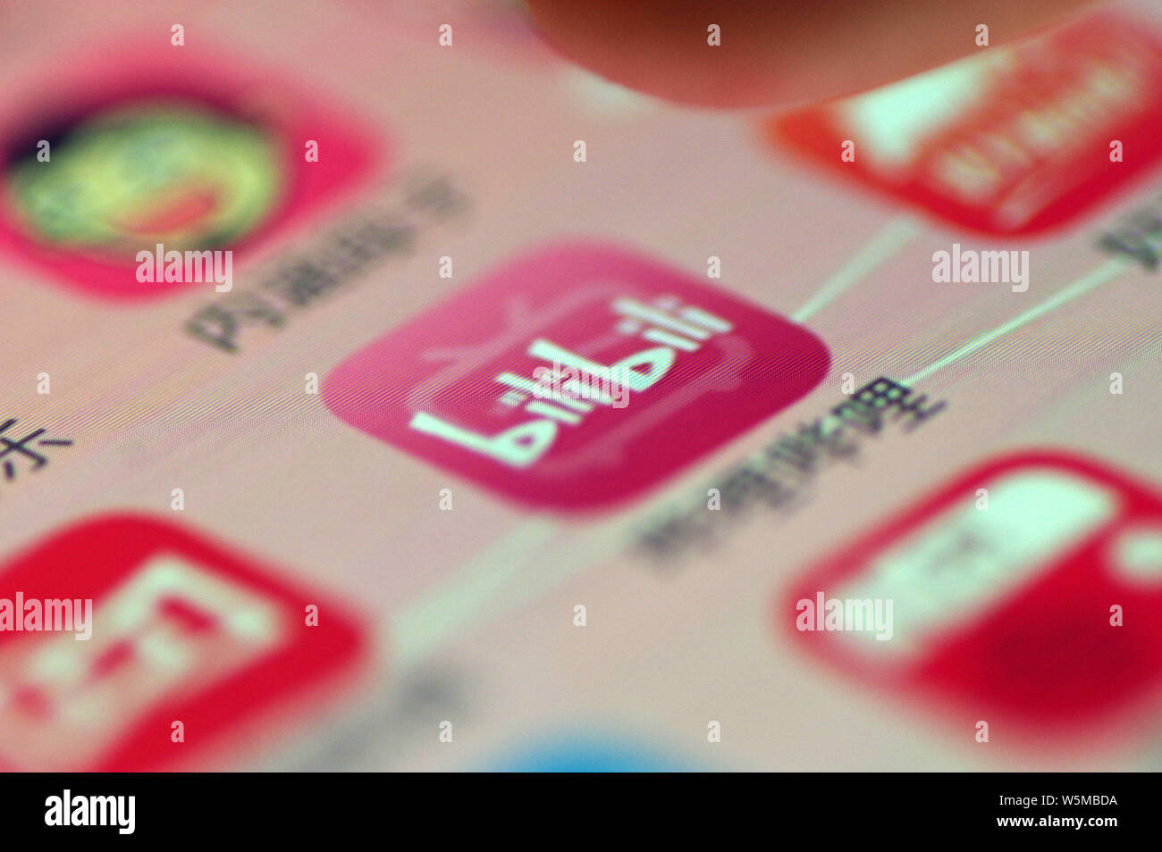--FILE--A netizen shows an icon of the mobile app of Chinese streaming ...