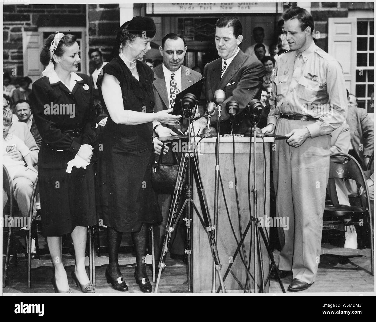Eleanor Roosevelt at stamp ceremony with Elliott Roosevelt in Hyde Park