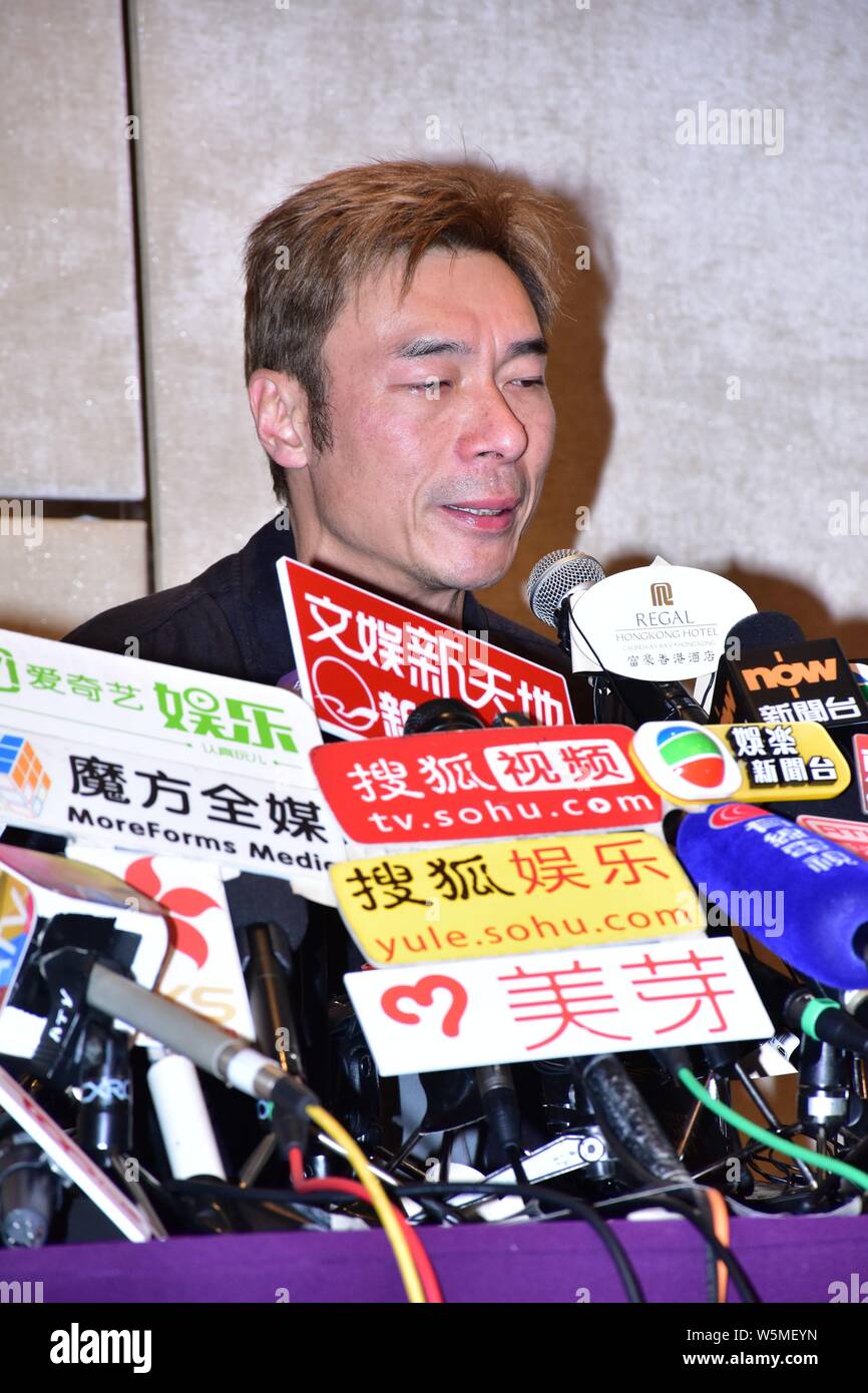 Hong Kong singer Andy Hui or Hui Chi-on speaks and weeps during a press conference to apologize to the public for cheating on his superstar wife Sammi Stock Photo