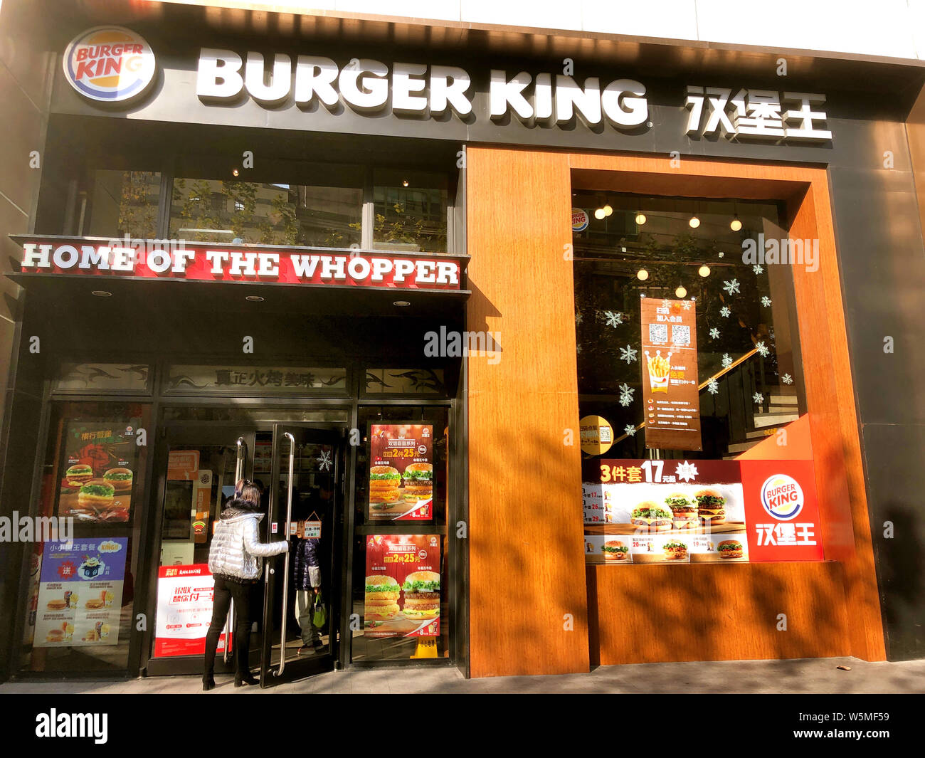 --FILE--A customer enters a fastfood restaurant of Burger King in Shanghai, China, 18 December 2018. US fast food chain Burger King on Tuesday apolo Stock Photo