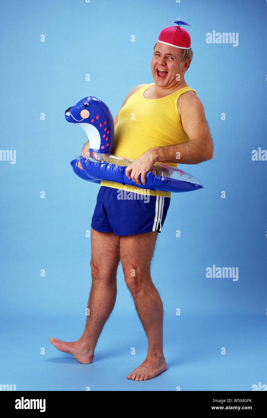 Man wearing a floaty about to go into the water” Stock Photo
