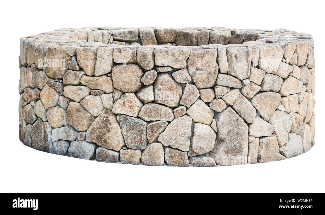 Traditional Ancient stone well isolated on white background. Object with clipping path Stock Photo