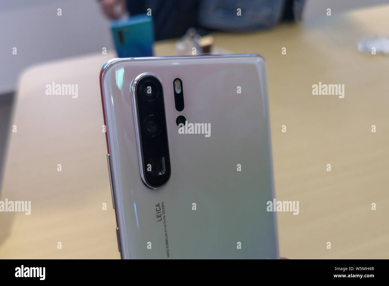 A customer shows a Huawei P30 Pro smartphone at a Huawei store in Shanghai,  China, 2 April 2019. Huawei's back with another Porsche Design model, an  Stock Photo - Alamy