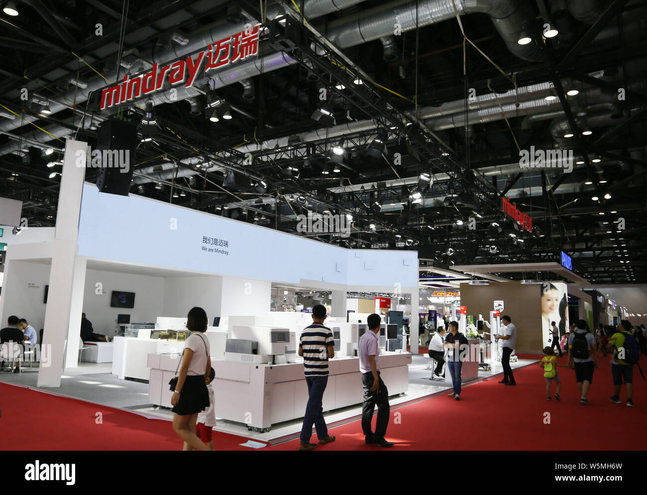 --FILE--People visit the stand of China's leading producer of medical devices Shenzhen Mindray Bio-Medical Electronics Co. Ltd. during an expo in Beij Stock Photo