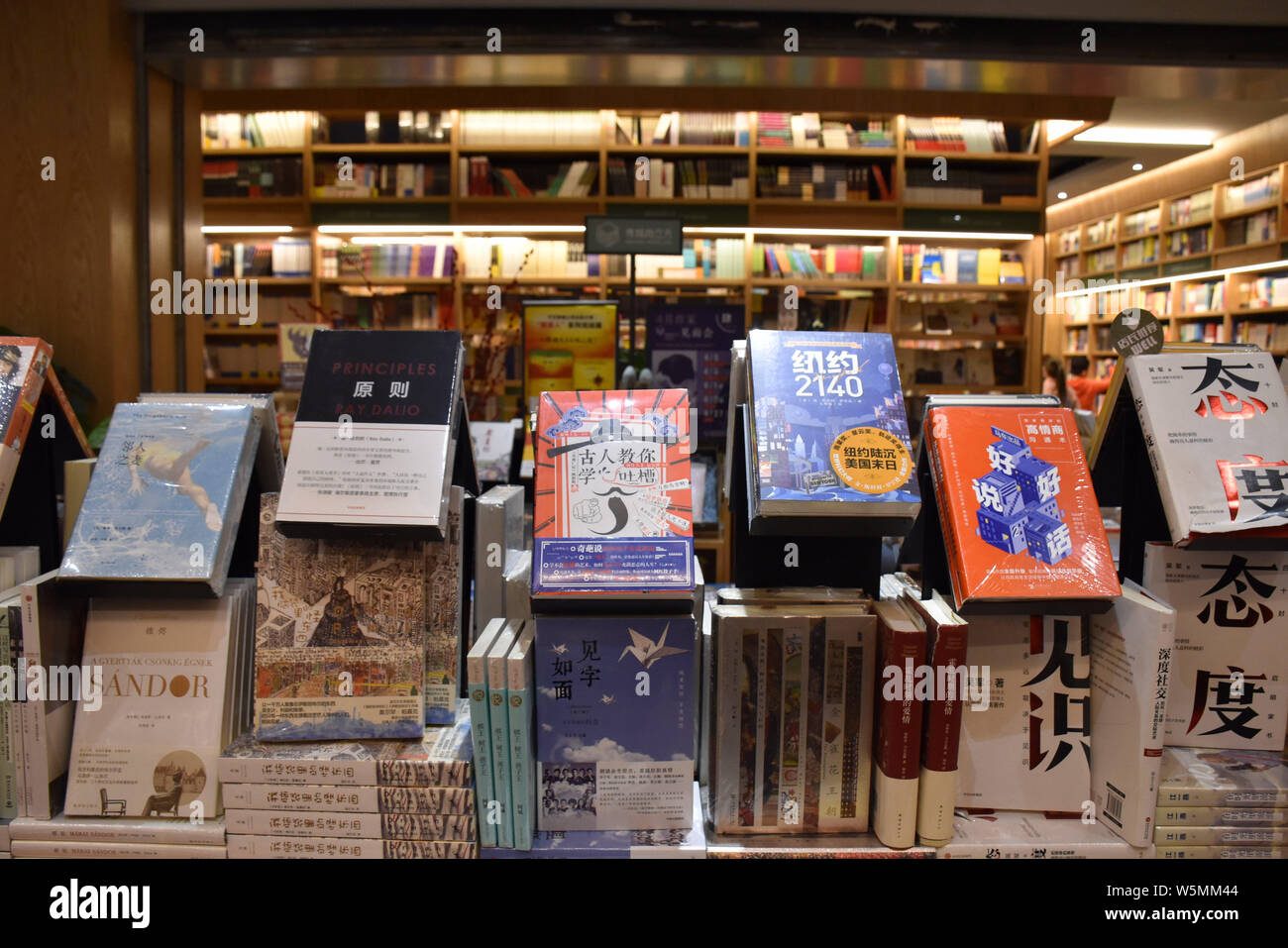 Customers read books at a new bookstore stacked with the innovative