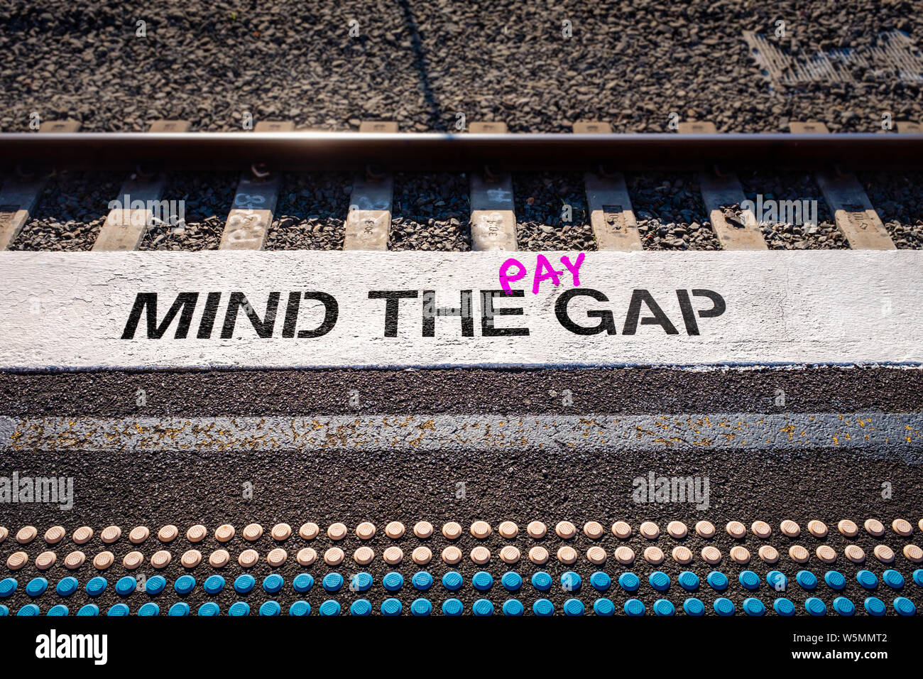 Pay gap, Mind the pay gap graffiti in pink, Gender pay equality concept illustration Stock Photo