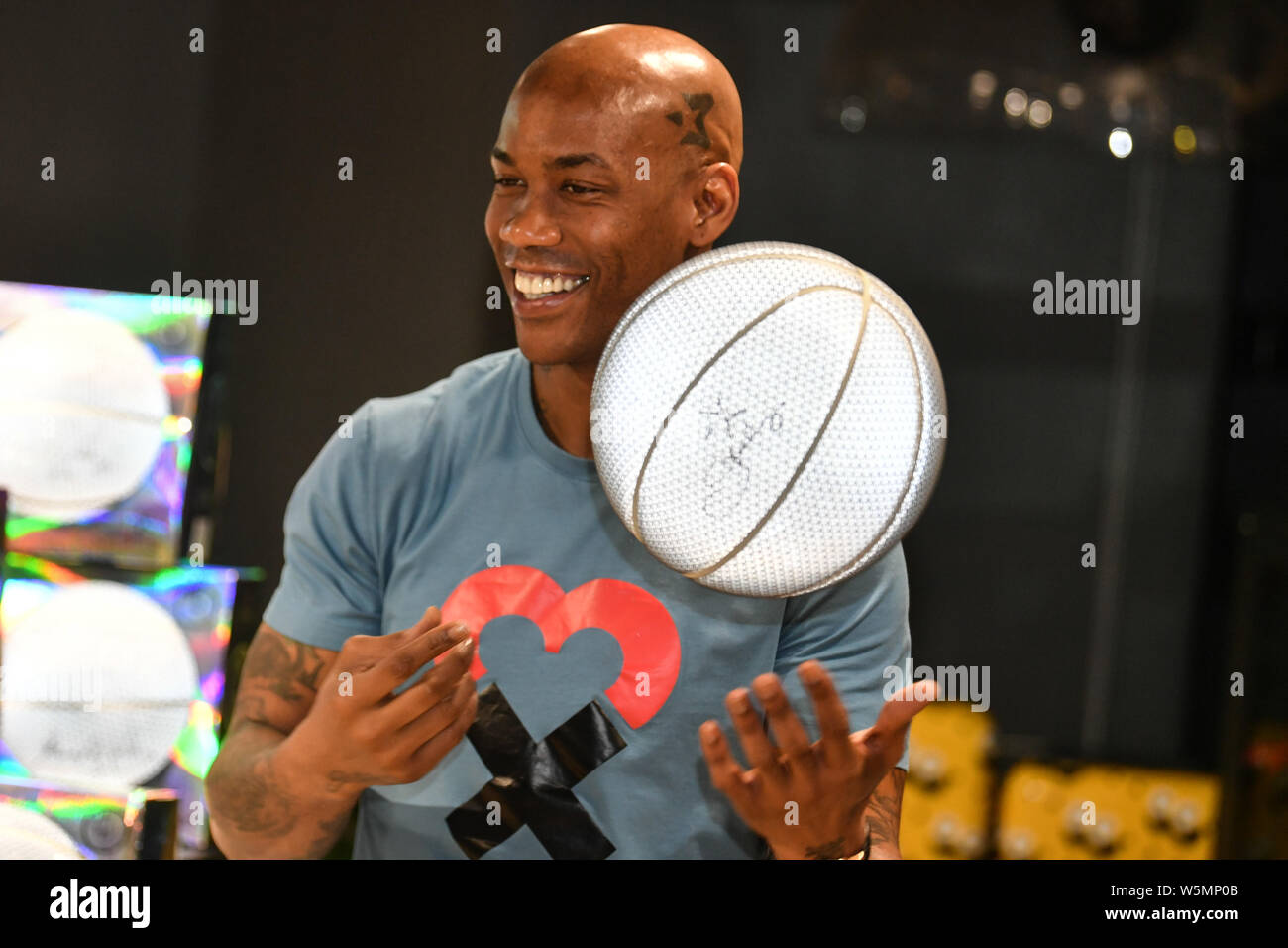 Retired American basketball player Stephon Marbury attends a fan