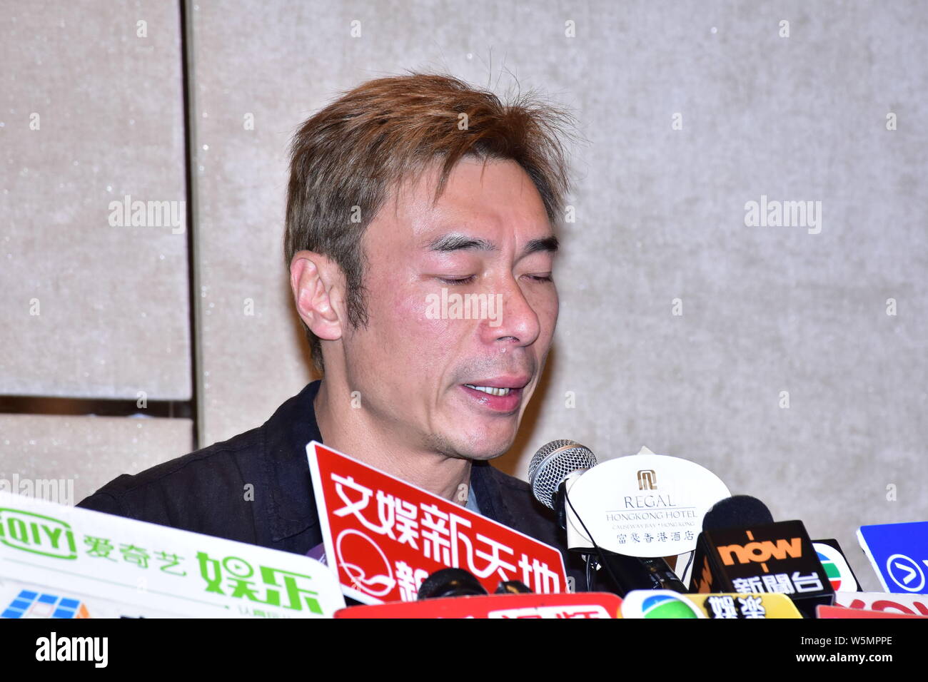 Hong Kong singer Andy Hui or Hui Chi-on speaks and weeps during a press conference to apologize to the public for cheating on his superstar wife Sammi Stock Photo