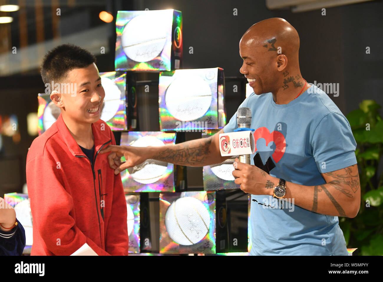 Retired American basketball player Stephon Marbury attends a fan