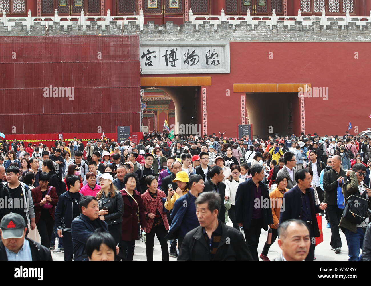Tourists visit the Palace Museum, also known as the Forbidden City