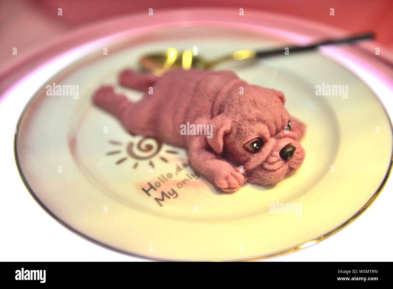 --FILE--A realistic dog cake is for sale at a bakery in Tianjin, China, 23 November 2018.   Puppy-shaped mousse cakes first became popular in Kaohsiun Stock Photo