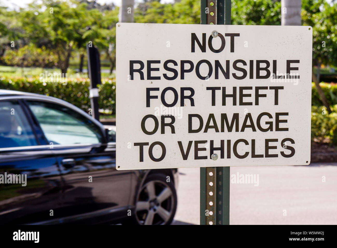 Florida,Broward,Fort Ft. Lauderdale,Coral Springs,parking lot,sign,warning,disclaimer,not responsible for theft,damage,car,FL091213044 Stock Photo