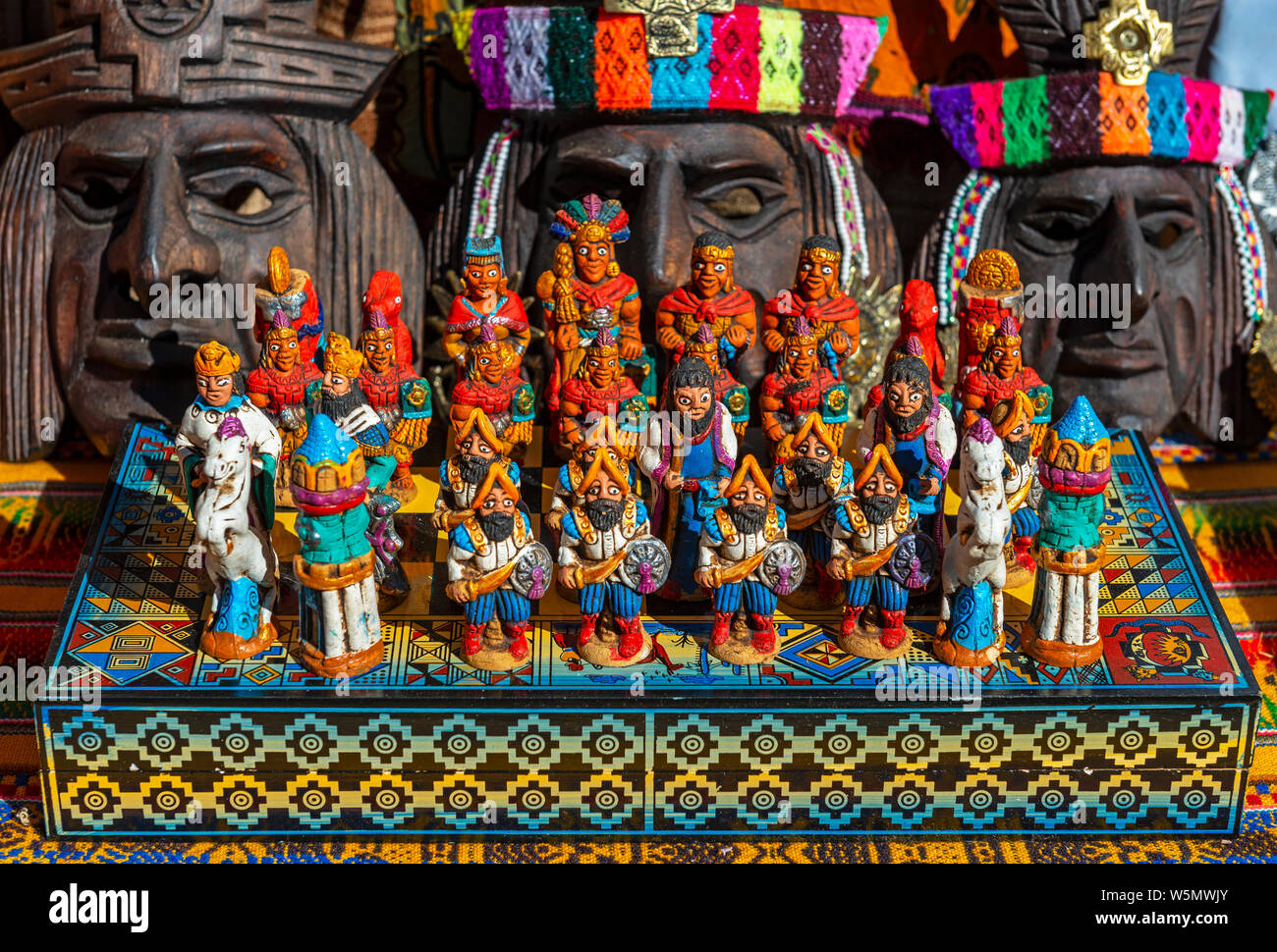 The traditional chess game board as art and craft product with Spanish against Inca on a local handicraft market in Cusco, Peru. Stock Photo