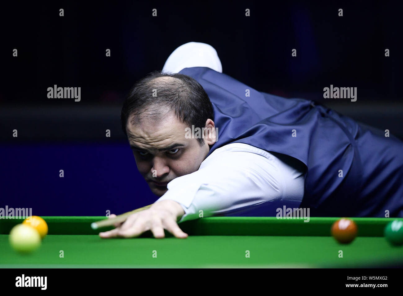 Waheed Snooker Soheil Vahedi of Iran plays a shot to Xiao Guodong of China in their ...