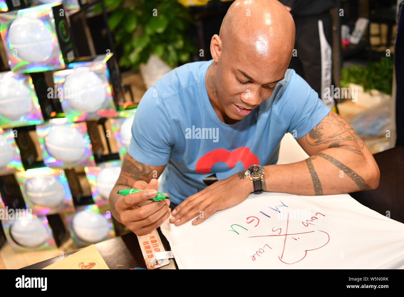 Retired American basketball player Stephon Marbury attends a fan