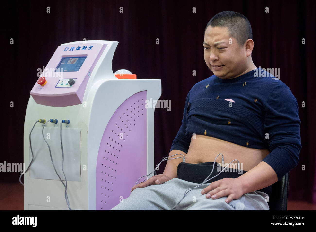 https://c8.alamy.com/comp/W5N0TP/the-face-of-an-expectant-father-contorts-as-he-experiences-the-pain-of-childbirth-via-a-simulation-machine-at-a-maternal-and-child-care-hospital-in-ta-W5N0TP.jpg