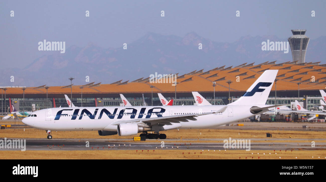 --FILE--An Airbus A330-300 jet plane of Finnair takes off at the Beijing Capital International Airport in Beijing, China, 7 December 2018.   Finnair, Stock Photo