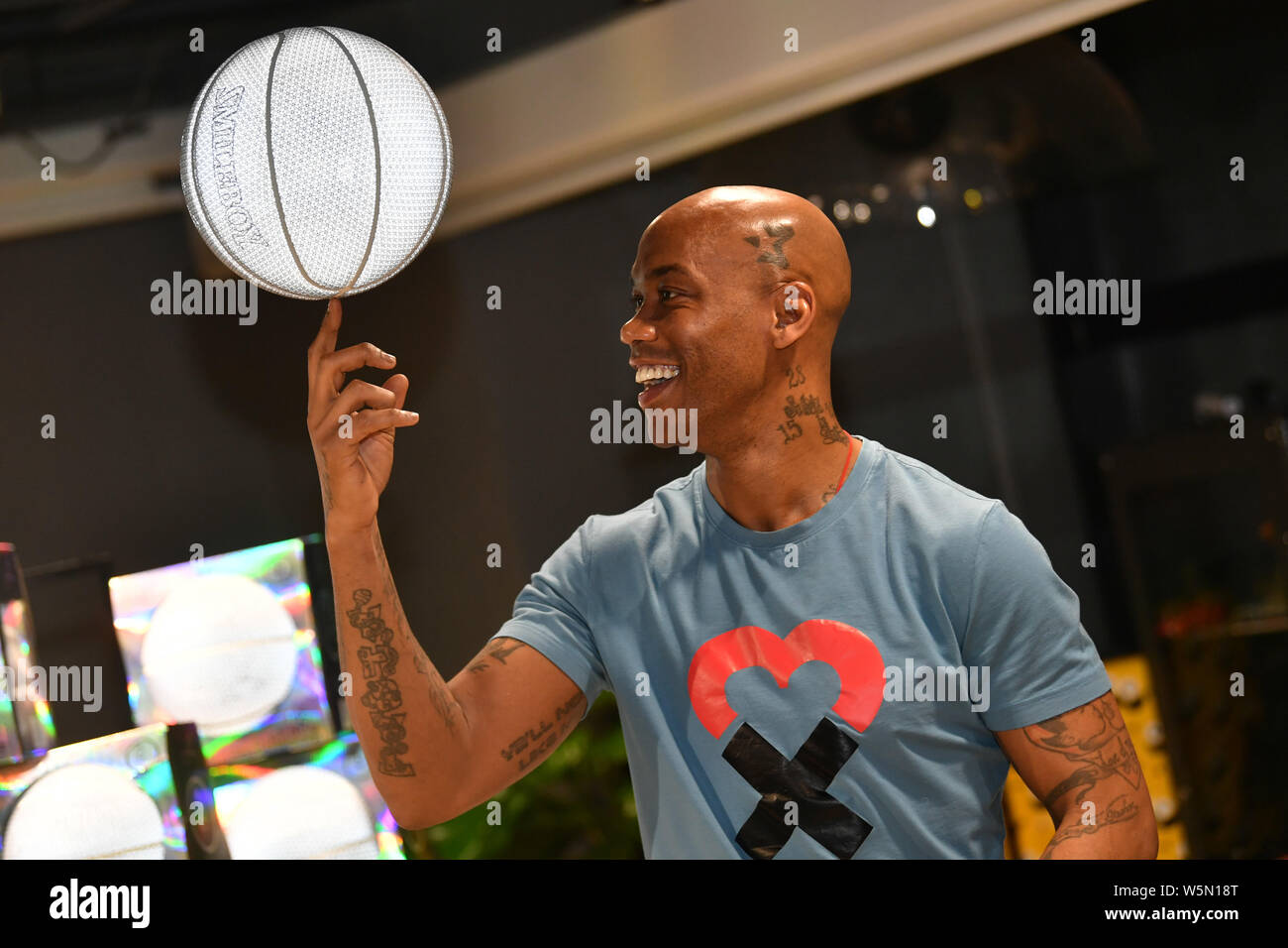 Retired American basketball player Stephon Marbury attends a fan