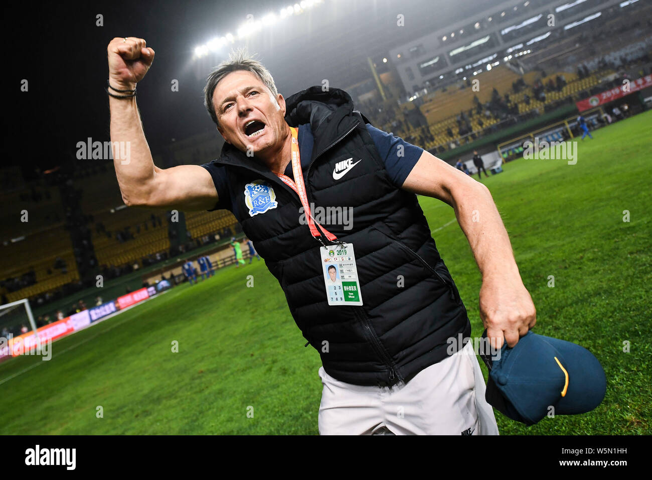 Head coach Dragan Stojkovic of Guangzhou R&F celebrates after scoring against Shanghai Greenland Shenhua in their 5th round match during the 2019 Chin Stock Photo
