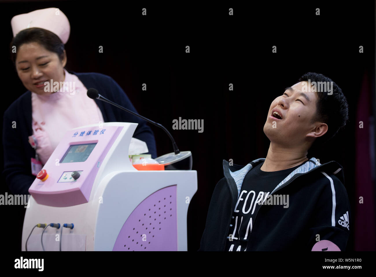 The face of an expectant father contorts as he experiences the pain of ...