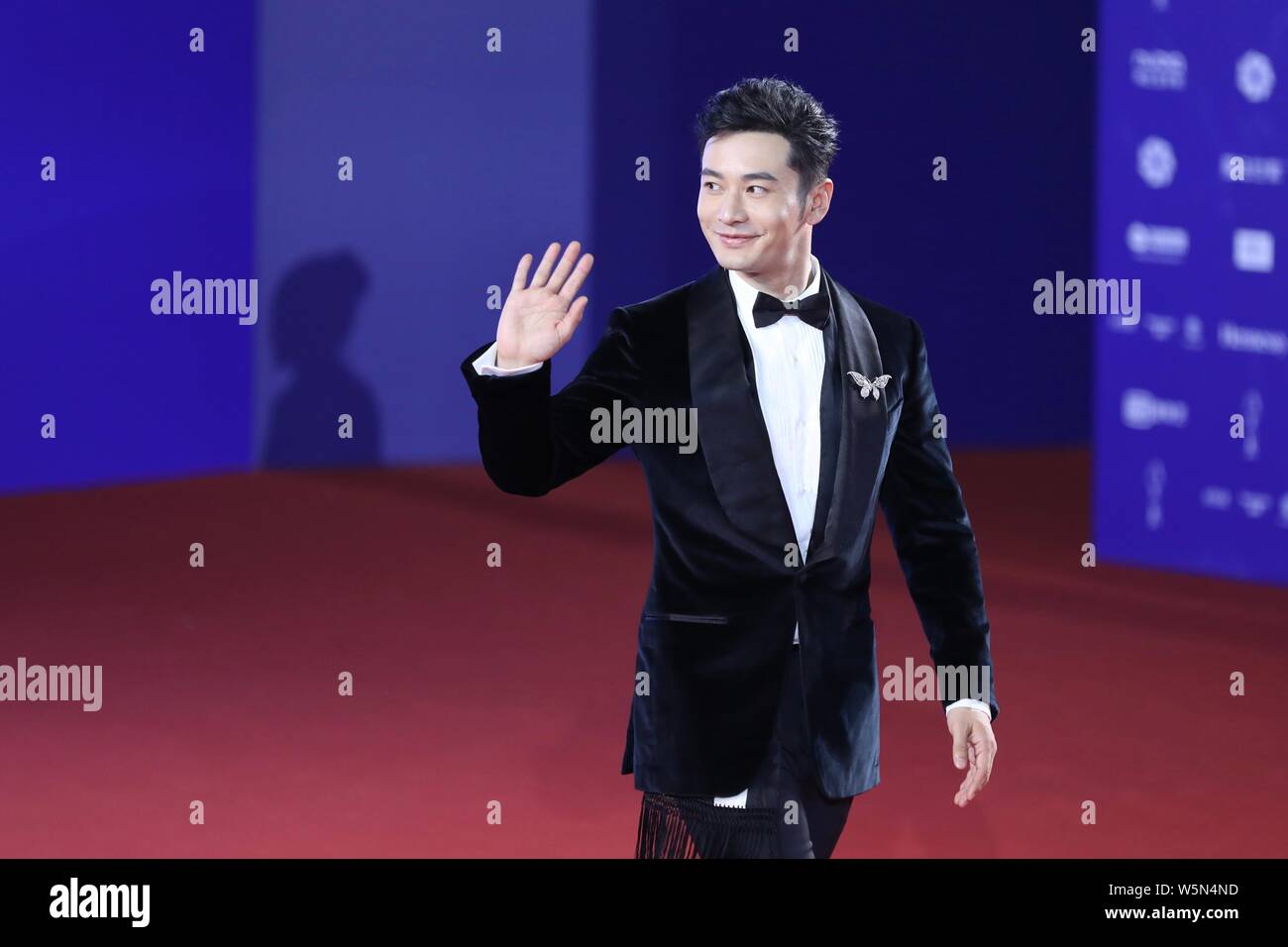 Chinese actor Huang Xiaoming arrives on the red carpet for the closing ...