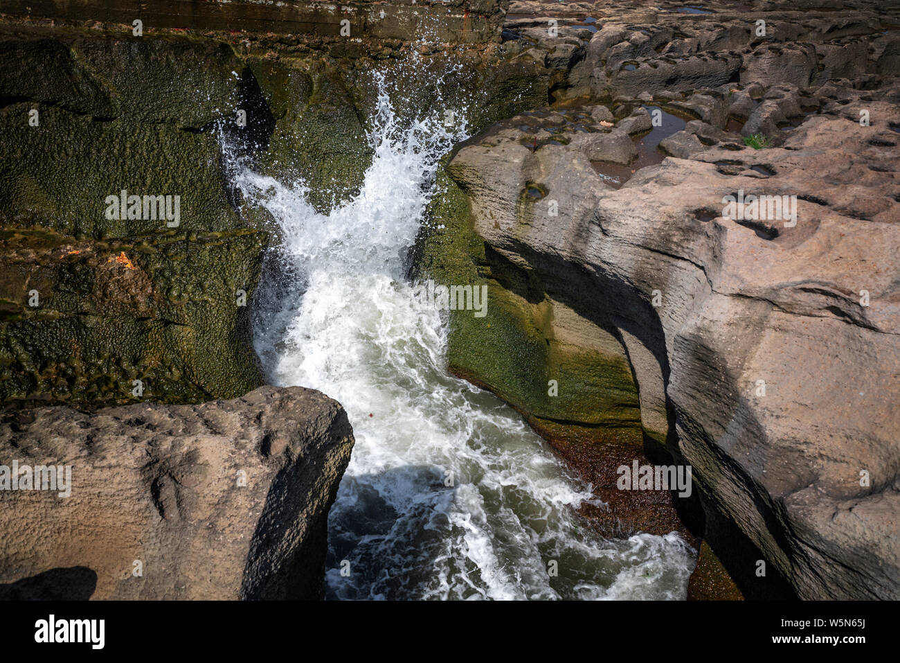 Sea wave in the coastal cave Stock Photo