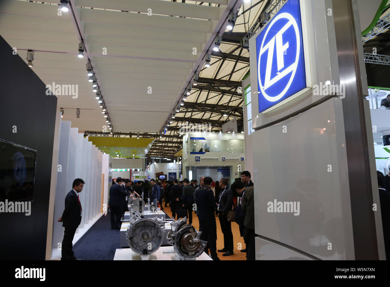 --FILE--Visitors crowd the stand of ZF Friedrichshafen during the 2014 Automechanika Shanghai (AMS) exhibition in Shanghai, China, 9 December 2014. Stock Photo