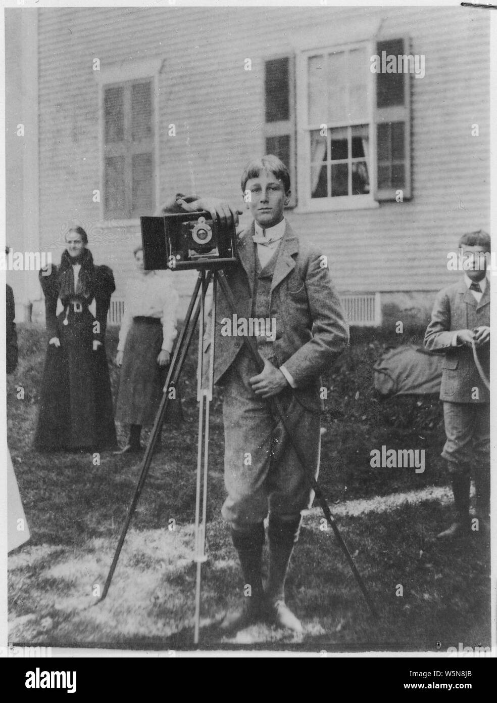 Franklin D. Roosevelt, standing with a camera in Fairhaven