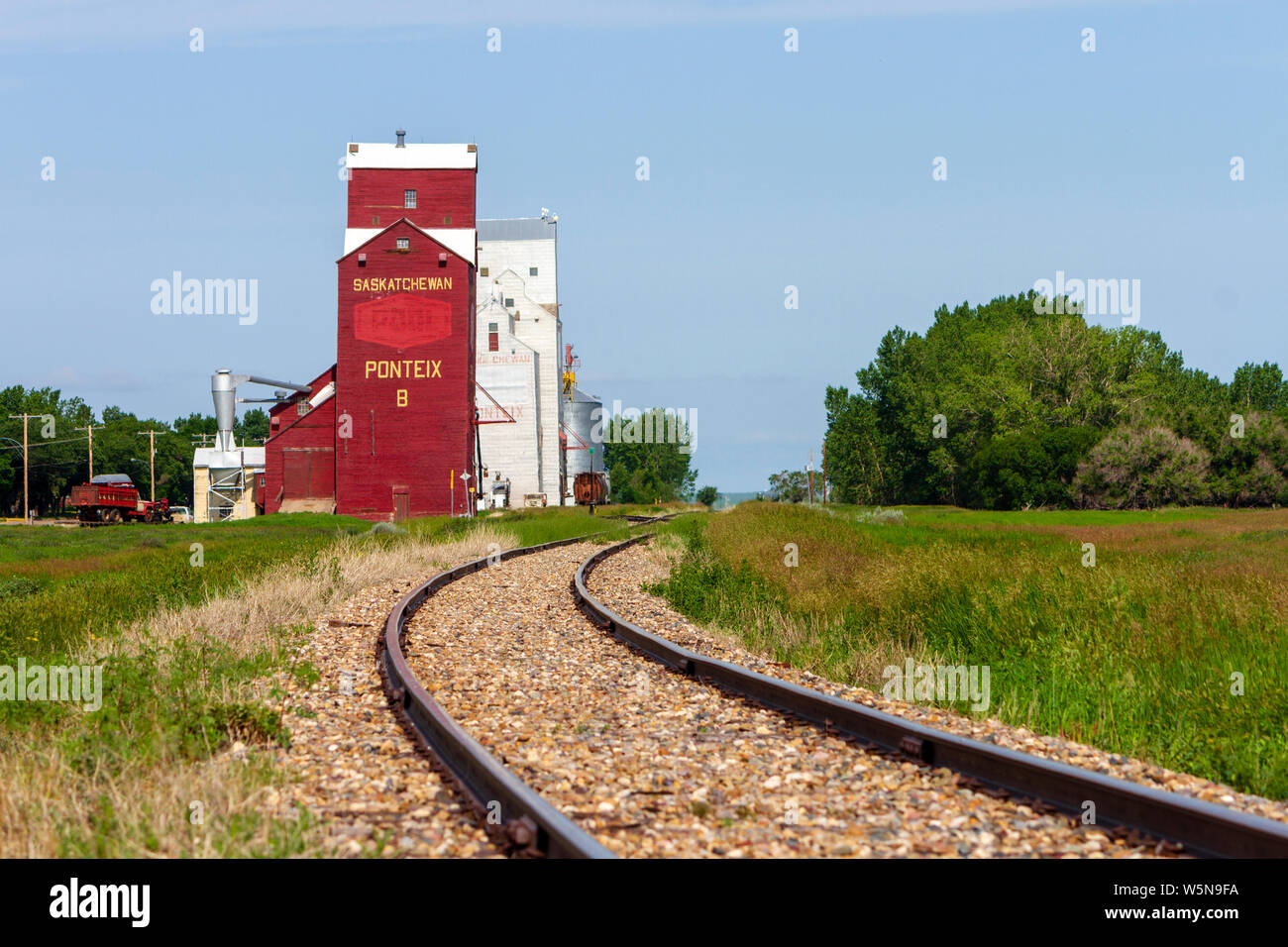 Pontiex, Saskatchewan, Canada - July 8, 2019: Landscape scenic view of old wooden grain elevator in the Canadian prairie town of Pontiex, Saskatchewan Stock Photo