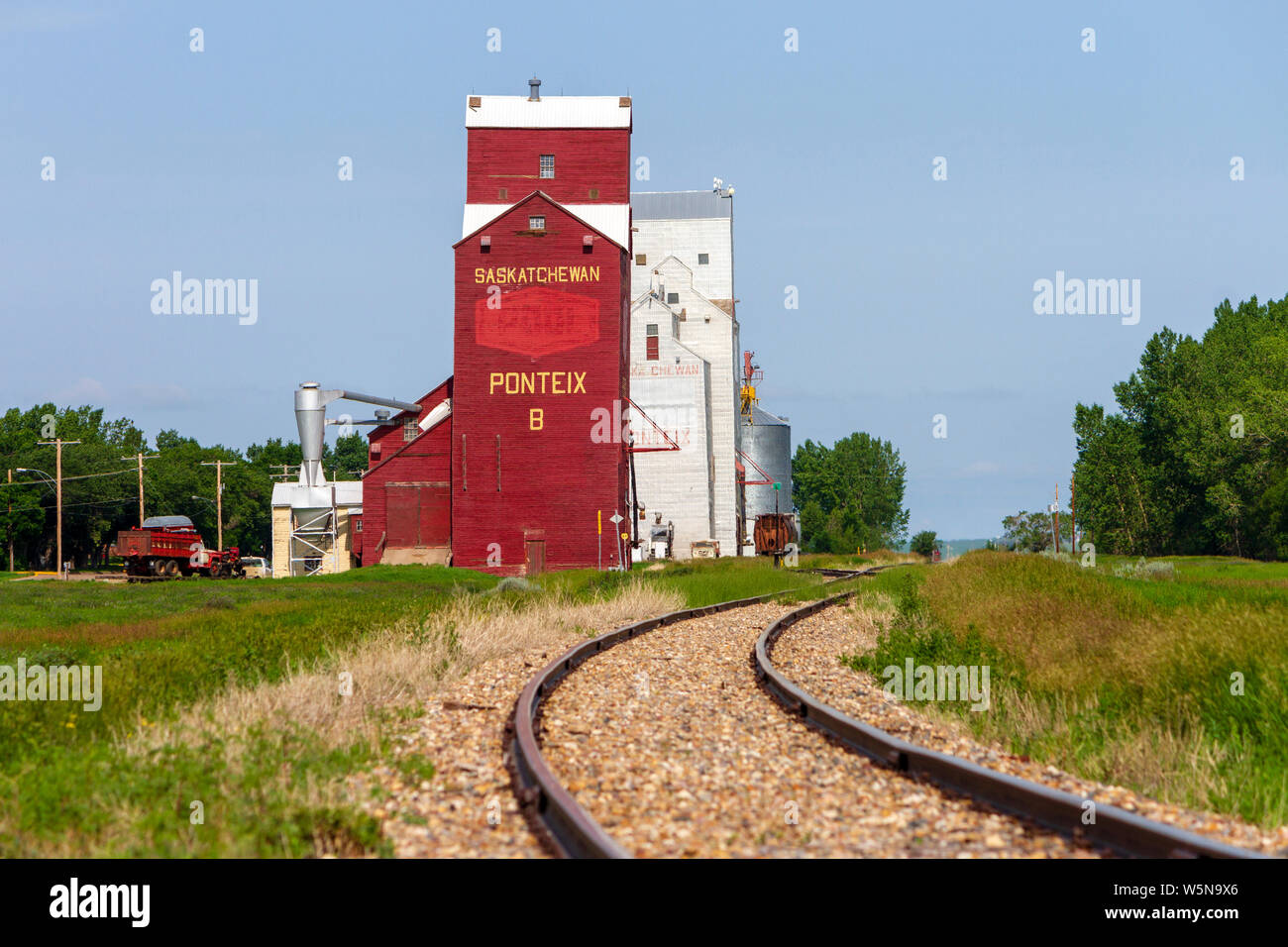 Pontiex, Saskatchewan, Canada - July 8, 2019: Landscape scenic view of old wooden grain elevator in the Canadian prairie town of Pontiex, Saskatchewan Stock Photo
